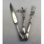 A French carving knife and fork with ham-bone holder, with .