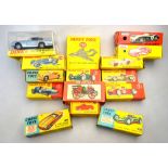 Nine boxed Dinky models: Aston Martin DB6 153, Ferrari Racing Car 242, BRM Racing Car 243,