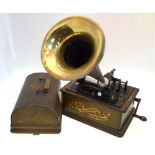 An Edison standard phonograph with oak case, the tin horn with brass end,