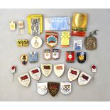 An interesting collection of Olympic and other enamel badges and lapel pins,