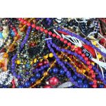 Box containing a large quantity of modern and vintage costume jewellery including beads, bangles,