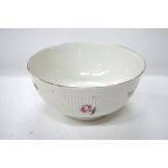 An English bowl with with ribbed exterior,