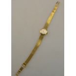 A lady's 9ct gold Rodania wristwatch with Swiss movement and flexible mesh bracelet,