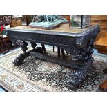 A Victorian oak library table in the Gothic style,