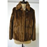 A light brown faux fur jacket retailed by Tyber, Belgium,