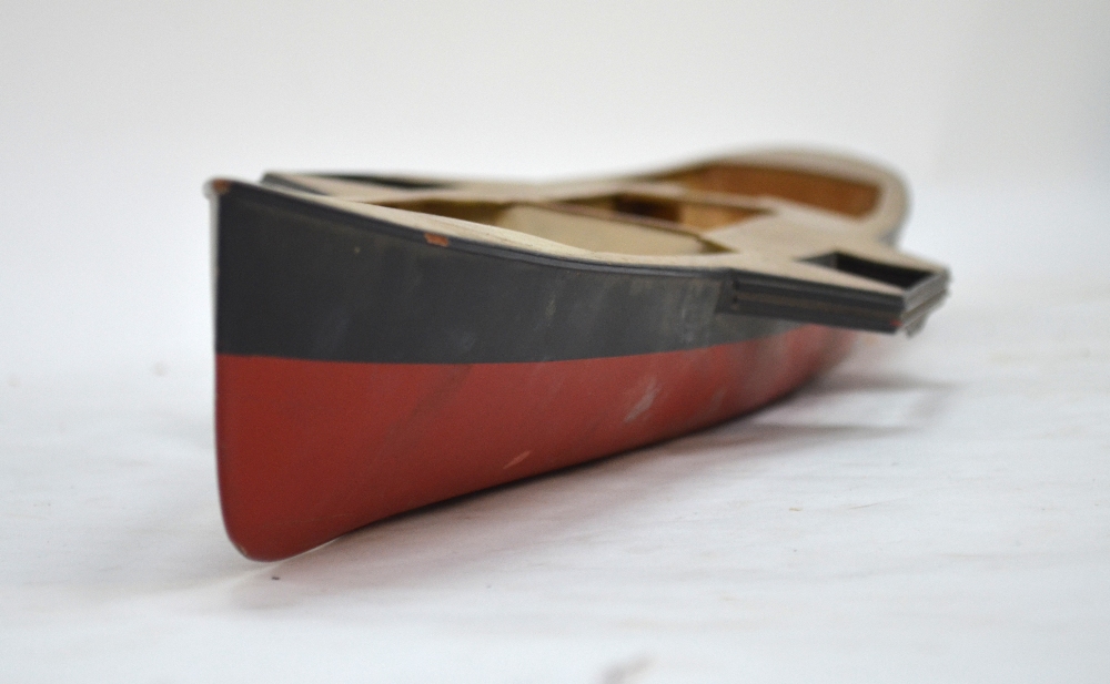 A vintage wooden pond-model hull of a Victorian paddle-steamer,