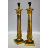 A pair of large giltwood fluted column table lamps,