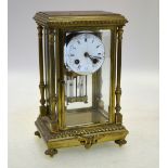 A French gilt brass four-glass clock, the drum movement with mercury pendulum,