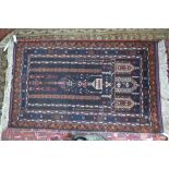 An Afghan Belouch prayer rug, blue/brown ground, 1.40 x 0.