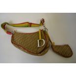 A Christian Dior fabric bag embossed with 'CD' monogram, saddle-bag style,