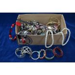 A box containing large quantity of modern and vintage costume jewellery mostly bangles etc