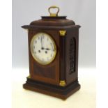 An inlaid mahogany mantle clock with French drum movement striking on a coiled gong,