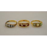 A collection of three rings - all yellow metal set including five pearl, red and white five stone,