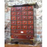 A small wood apothecary, or other cabinet,