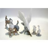 Lladro models - White bird on a branch, 19 cm high; Squirrel on a branch, 22.