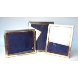 Three silver easel photograph frames,