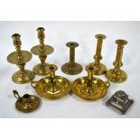 A pair of antique brass chambersticks with adjustable sockets,