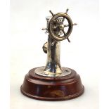 A novelty silver cigar-cutter in the form of a ship's wheel, H. S.