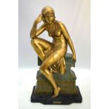 An Art Deco painted plaster figure of a semi-nude dancing girl,