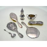 A quantity of silver items, including two hand-mirrors, two hairbrushes, sugar basin,