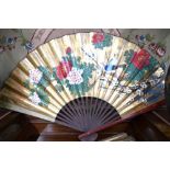 A pair of large Chinese fans; each one decorated with natural history designs;