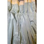 A pair of eau de nil moire silk effect lined and inter-lined curtains edged in ivory,