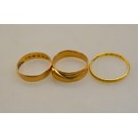 Three old gold rings including serpent,