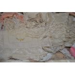 An embroidered cream silk small coverlet, to/w assorted lengths of lace and crocheted lengths,