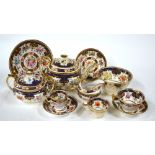 An early 19th century Ridgway tea service decorated with finely painted polychrome flowers within a