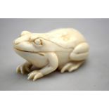 A 19th century carved ivory frog, hinged as a scent-flask holder,