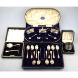 A matched silver three-piece condiment set with spoons, to/w a napkin ring,