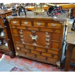 A Chinese or Korean rectangular cabinet with central hinged doors and integral padlock beneath four