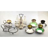 Hukin & Heath: four electroplated egg-cups with plate-clips-three with Royal Doulton china dishes,