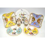 A Meissen plate painted with songbirds and insects within a shaped gilt border, 23 cm diam.