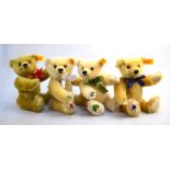 Four Steiff mohair teddy bears, each with a footpad embroidered with either a daffodil, rose,