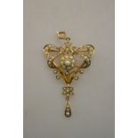 An Art Nouveau pendant/brooch set overall with small pearls stamped 9c