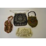 An Edwardian black and silver beaded evening bag, a smaller multi-colour beaded bag,