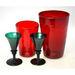 Two green 19th century port glasses having conical bowls terminating in a blade knop,