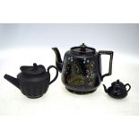 Three black teapots,