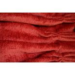 A single lined and inter-lined curtain in a cherry red textured dralon fabric,