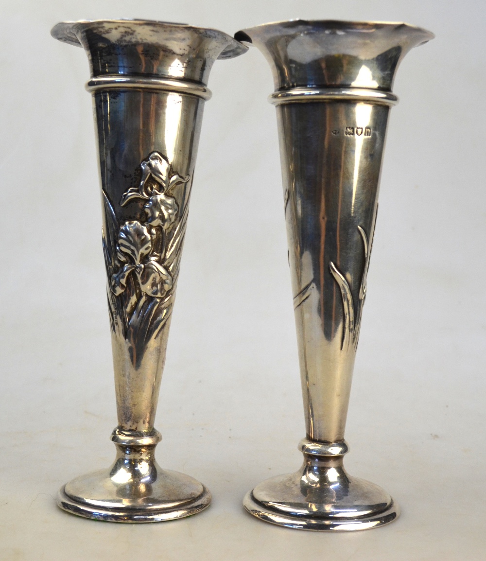 A pair of Edwardian loaded silver specimen vases of tapering form, embossed with irises, - Image 4 of 5