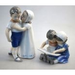 Two Royal Copenhagen figural groups - Reading children, no. 402 and Love Refused, no.