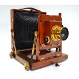 A Thornton Pickard brass-mounted mahogany half-plate camera with Time & Inst.