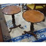 A pair of Georgian style tripod tables,