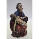 An antique Continental painted lime-wood Pieta (Mary weeping with the crucified Christ across her