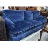 A companion pair of blue velvet upholstered country house sofas with contrasting rope twist edging