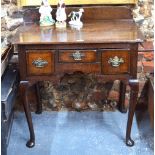 An early 18th century oak low boy,