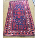 An old Afghan Belouch rug, the geometric design on blue/red ground, 1.95 x 1.