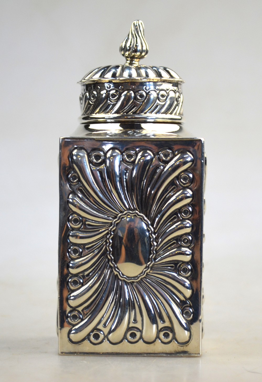 A Victorian embossed silver tea caddy of square form with domed cover, William Comyns & Sons, - Image 3 of 6