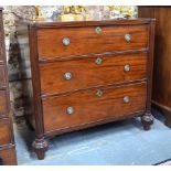 A 19th century mahogany commode having three long drawers flanked by fluted full-height pilasters,